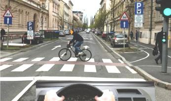 In the situation shown in the picture of the cyclist, the road passes to: