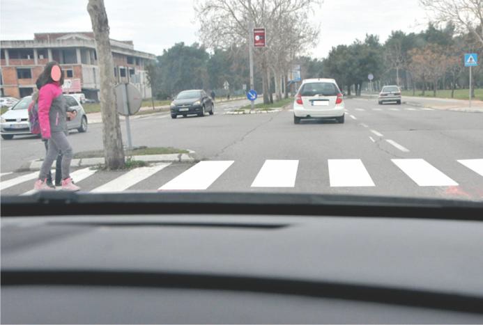 In the situation shown in the picture, the cross markings on the pavement indicate: